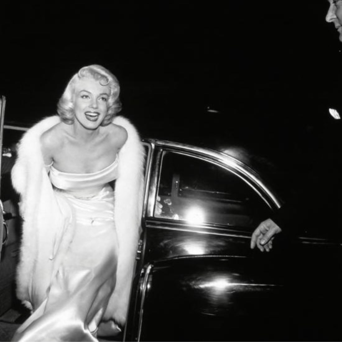 MARILYN MONROE (AMERICAN) PHOTO PRINT: Marilyn Monroe (American) Photo Print. Walking out of Car. 29.50 x 29.00 inches.