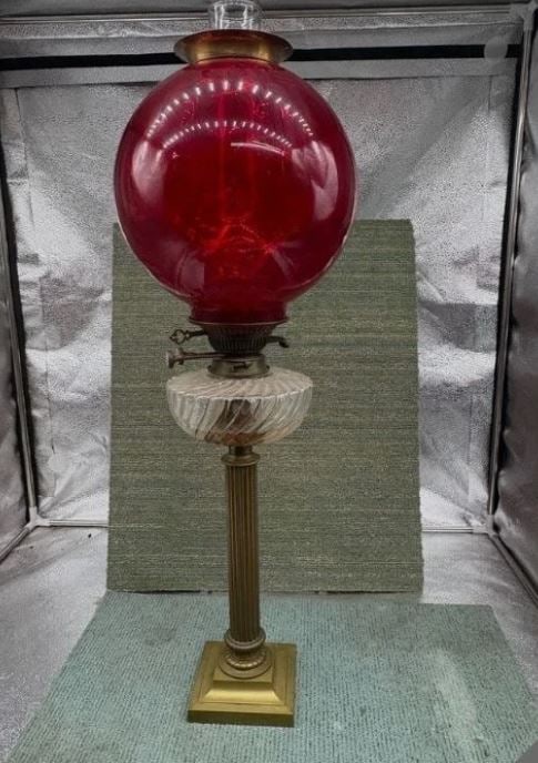 Messenger’s Duplex No. 2 Kerosene Oil Lamp with Ruby Red Glass Globe: Offered for auction is a vintage Messenger’s Duplex No. 2 kerosene oil lamp, featuring a striking large ruby red glass globe mounted above a brass column base.This classic oil lamp design includes a