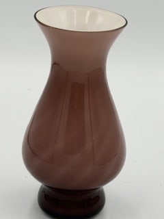 Scandinavian cased art glass vase, possibly Aseda Glasbruk, Sweden, 1960s: Mid-century Scandinavian art glass vase featuring a bulbous form with a narrow neck and flared rim. Executed in purple cased glass over a white interior, the vase displays subtle vertical ribbing and
