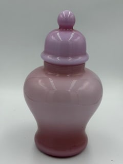 Fidella Italy Pink Cased Glass Covered Jar, Mid-Century: Mid-century Italian art glass covered jar by Fidella, featuring a rounded urn form with fitted lid and finial. Executed in pink cased glass with a soft opaline interior, the piece displays a smooth, g