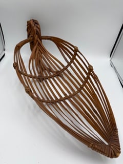 Mid-Century Modern Woven Rattan Fish Trap Form Basket, Boat Shape: Mid-century modern hand-woven rattan basket inspired by traditional fish trap forms, featuring an elongated boat-shaped design with openwork construction. The sculptural form is created with curved ri