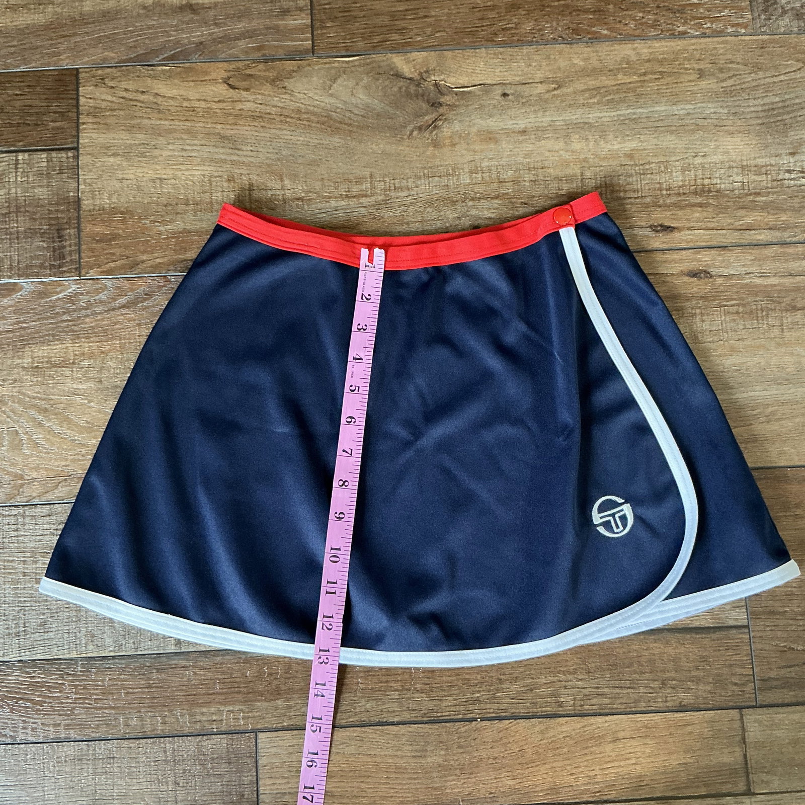 Vintage Sergio Tacchini Tennis Skirt Navy Blue Red Trim Athletic Skort 80s 90s: Classic vintage Sergio Tacchini tennis skirt in a sleek navy blue with bold red and white trim. This piece embodies iconic retro sportswear style from the 80s–90s, perfect for both performance and s
