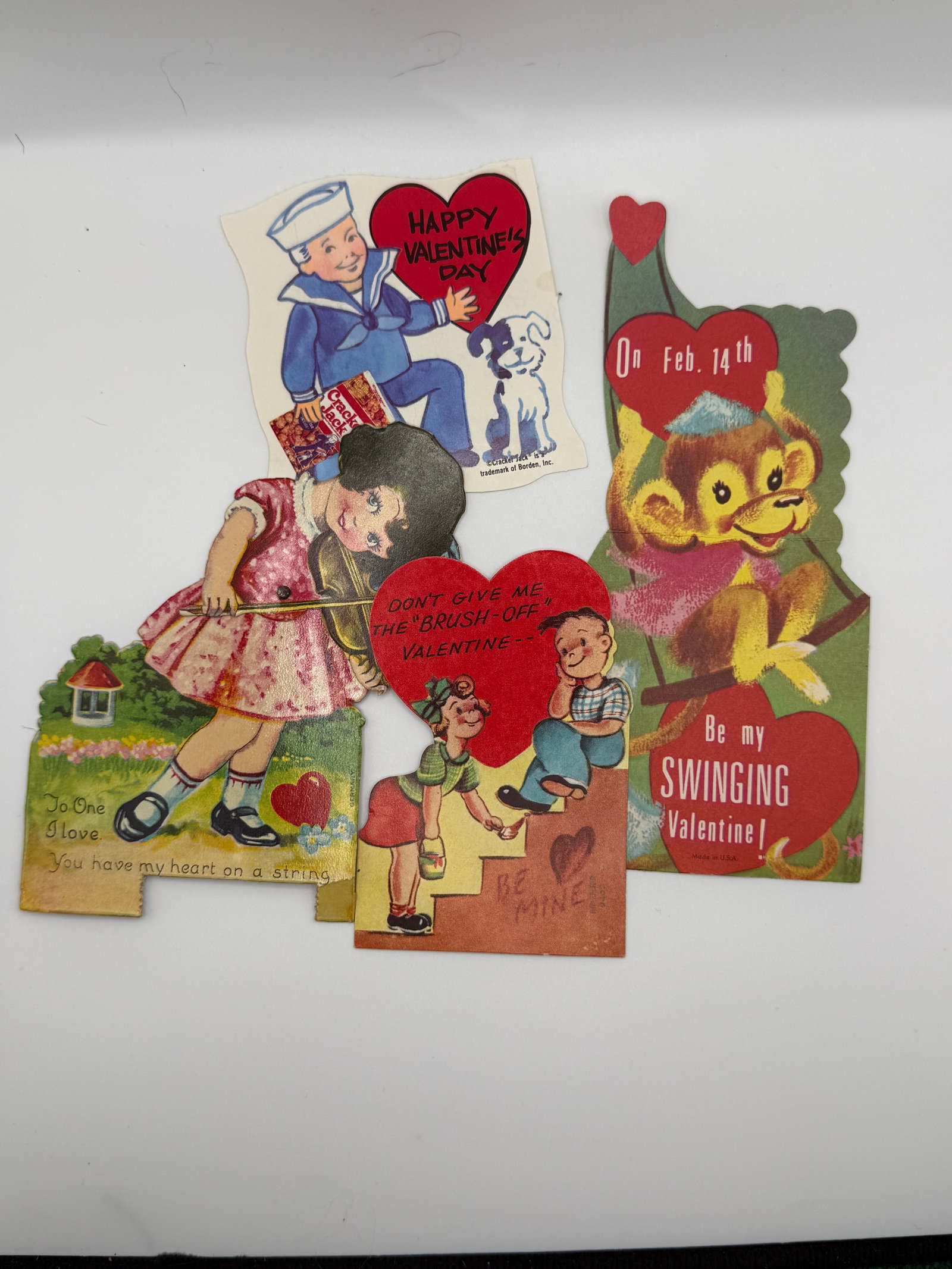 5 Vintage Valentine Cards Die Cut Kids Sailor Monkey Puppy Mid Century Valentines: Collection of 5 vintage Valentine’s Day cards featuring bright, playful mid-century designs with die-cut shapes.Includes:Sailor boy with puppy (“Happy Valentine’s Day”)Girl with heart/stri