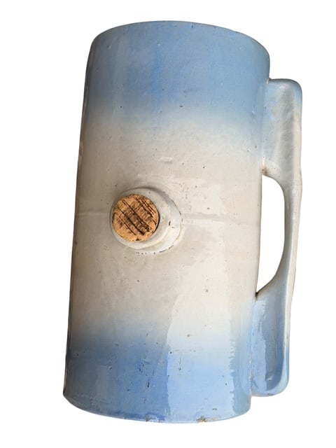 Logan Pottery Co. Patent Stoneware Jug with Spigot Blue White Glaze Antique Foot Warmer: Antique stoneware jug by Logan Pottery Co. (Logan, Ohio) featuring a classic cylindrical form with handle and side spigot opening. The base is clearly stamped “Logan Pottery Co. Logan O. – Patente