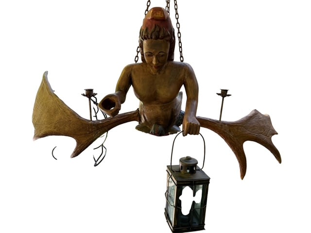Black Forest Lustermanchen Mermaid Figure Moose Antler Chandelier: Exceptional Black Forest style Lustermanchen chandelier figure depicting a carved mermaid or siren form suspended between large carved antler-form arms. The figure features a stylized fish tail with c