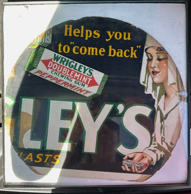 Rare WWI Era Wrigley’s Doublemint Gum Trolley Car Advertising Sign – “Helps You to Come: Rare and highly collectible World War I era Wrigley’s Doublemint chewing gum advertising sign originally used in a trolley or streetcar advertising display. This striking antique advertisement featu