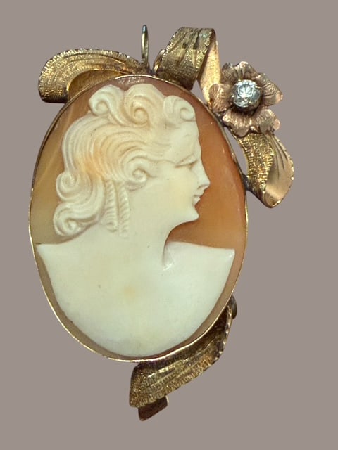 Antique 10K Gold Hand-Carved Shell Cameo Brooch Pendant, Diamond Accent: Beautiful antique hand-carved shell cameo brooch/pendant featuring the elegant profile of a young woman against a warm peach shell background. The cameo is mounted in an ornate tested 10K yellow gold 