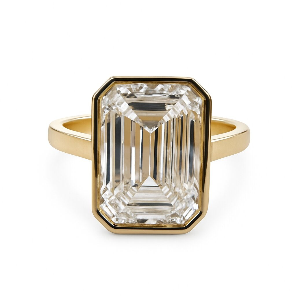 IGI Certififed Lab Grown Emerald Cut Bezel Engagement Ring 5.25 Carats 18K: IGI Certified Lab Grown engagement ring featuring a 5.25 Carat Emerald Cut Diamond in a bezel design, 18 Karat Yellow Gold. Color F Clarity VS2