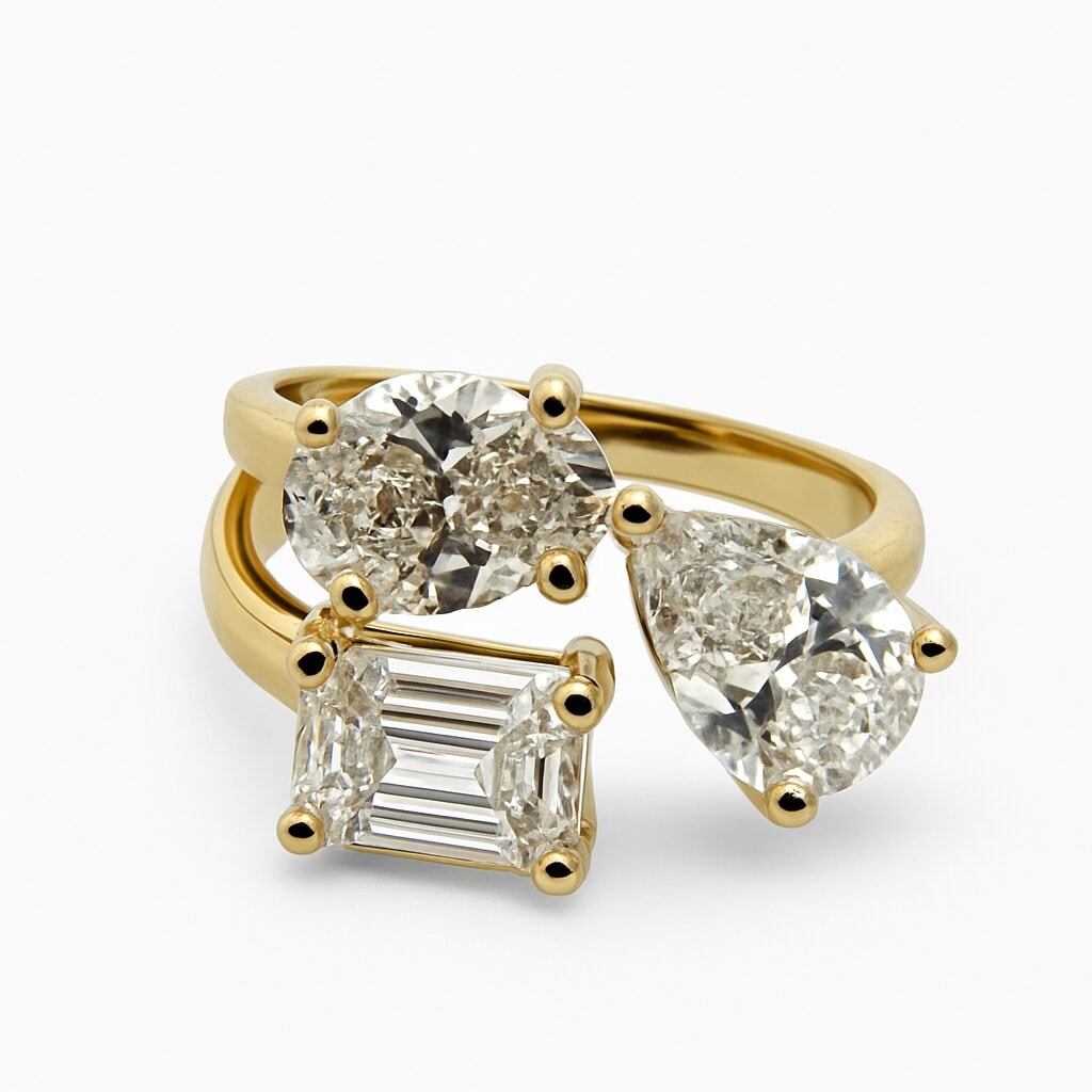 IGI Certified Three Stone Multi-Shape Ring 3.34 Carats 14K: IGI Certified Lab Grown ring featuring three multi-shape diamonds, Oval, Pear & Emerald, weighing 3.34 carats in 14 Karat Yellow Gold.
