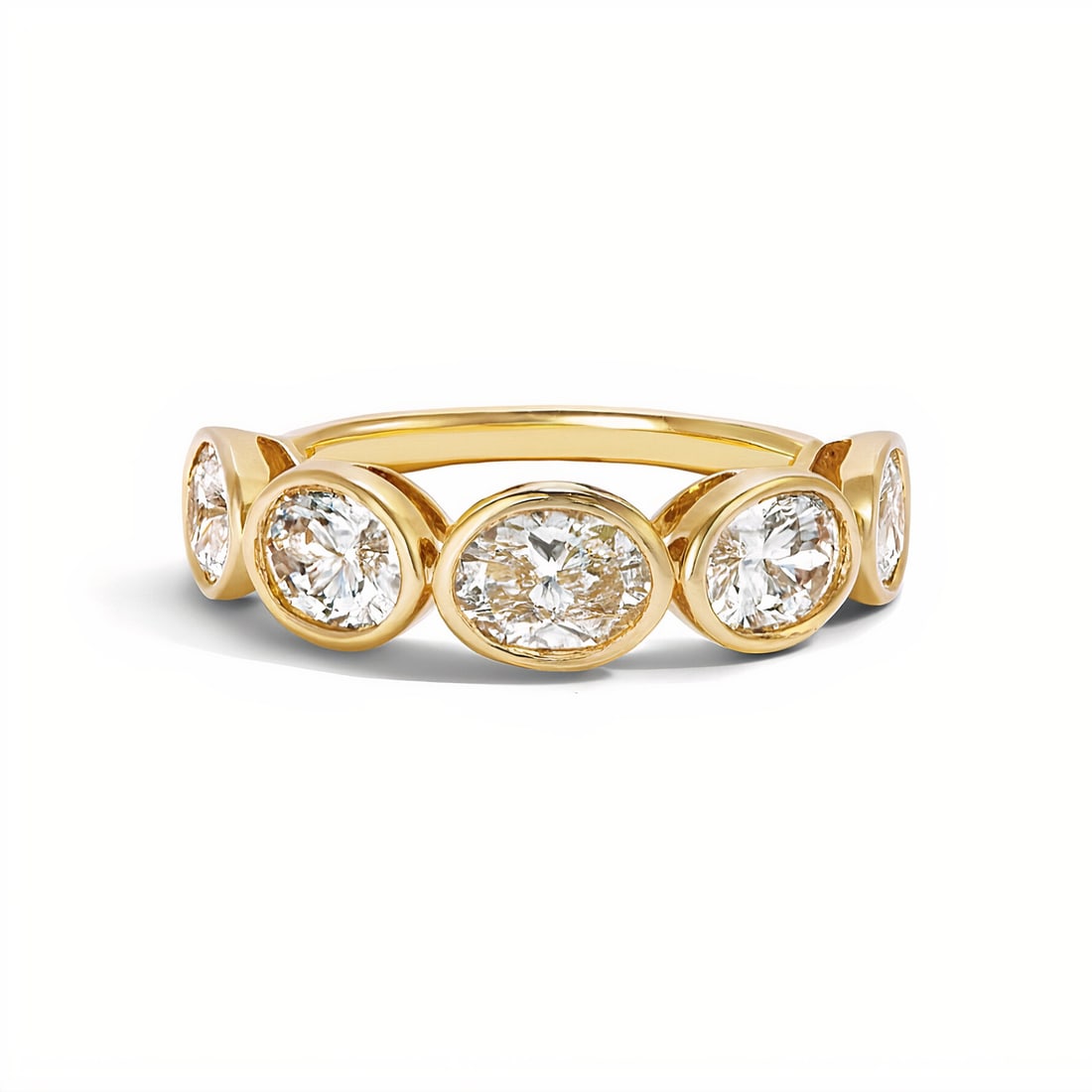 Lab Grown Five Stone Oval Shape Stackable Band Ring 2 Carats 14K: Lab Grown diamond bezel band ring featuring five Oval Shape diamonds weighing 2 Carats in an East-West design, in 14 Karat Yellow Gold. Avergae Stone 0.40 Carats. Color F Clarity VVS2-VS2