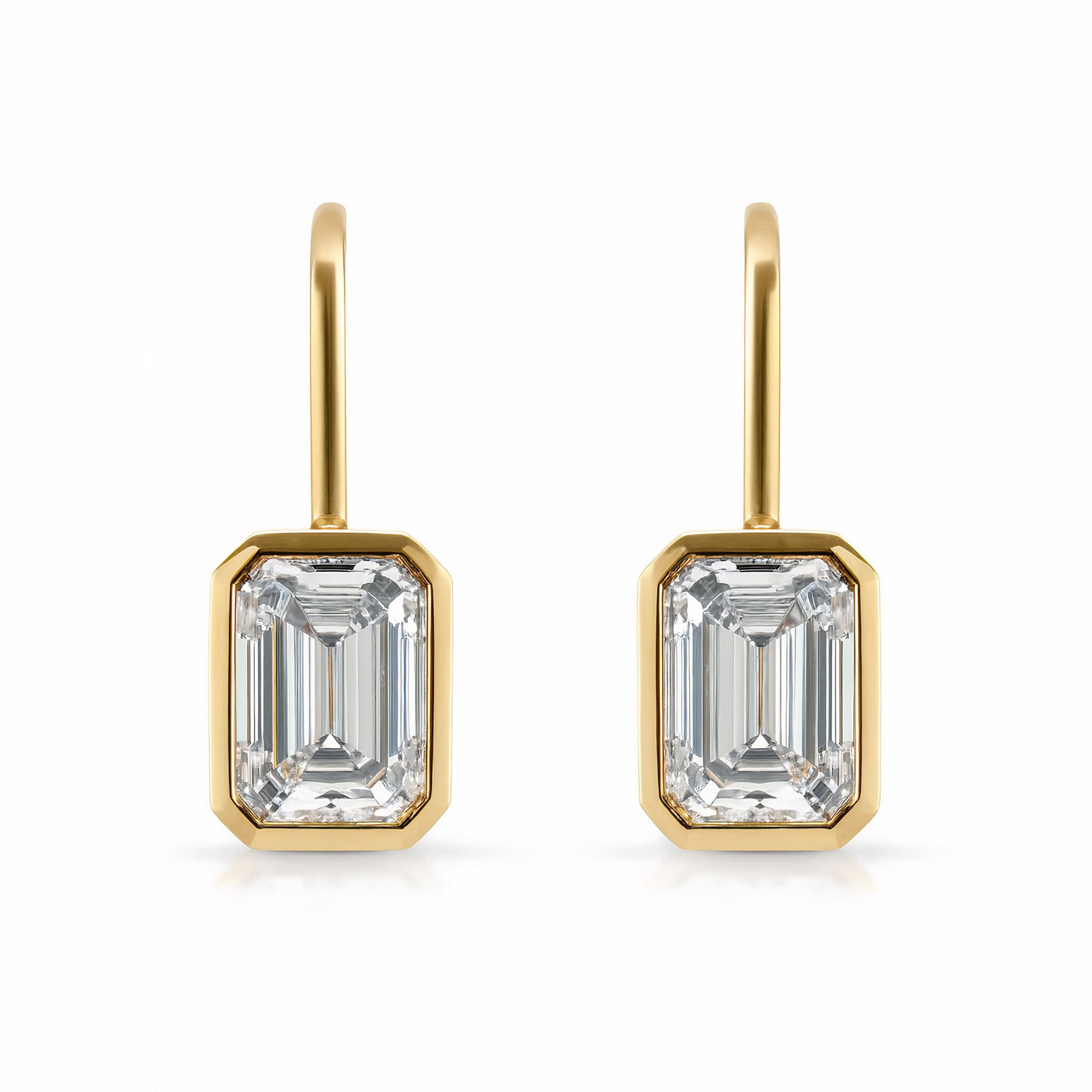 IGI Certified Lab Grown Emerald Cut Bezel Drop Earrings 6 Carats D VS1: IGI Certified Lab Grown Emerald Cut Earrings featuring a drop bezel crafted in 14K Yellow Gold. Color D Clarity VS1