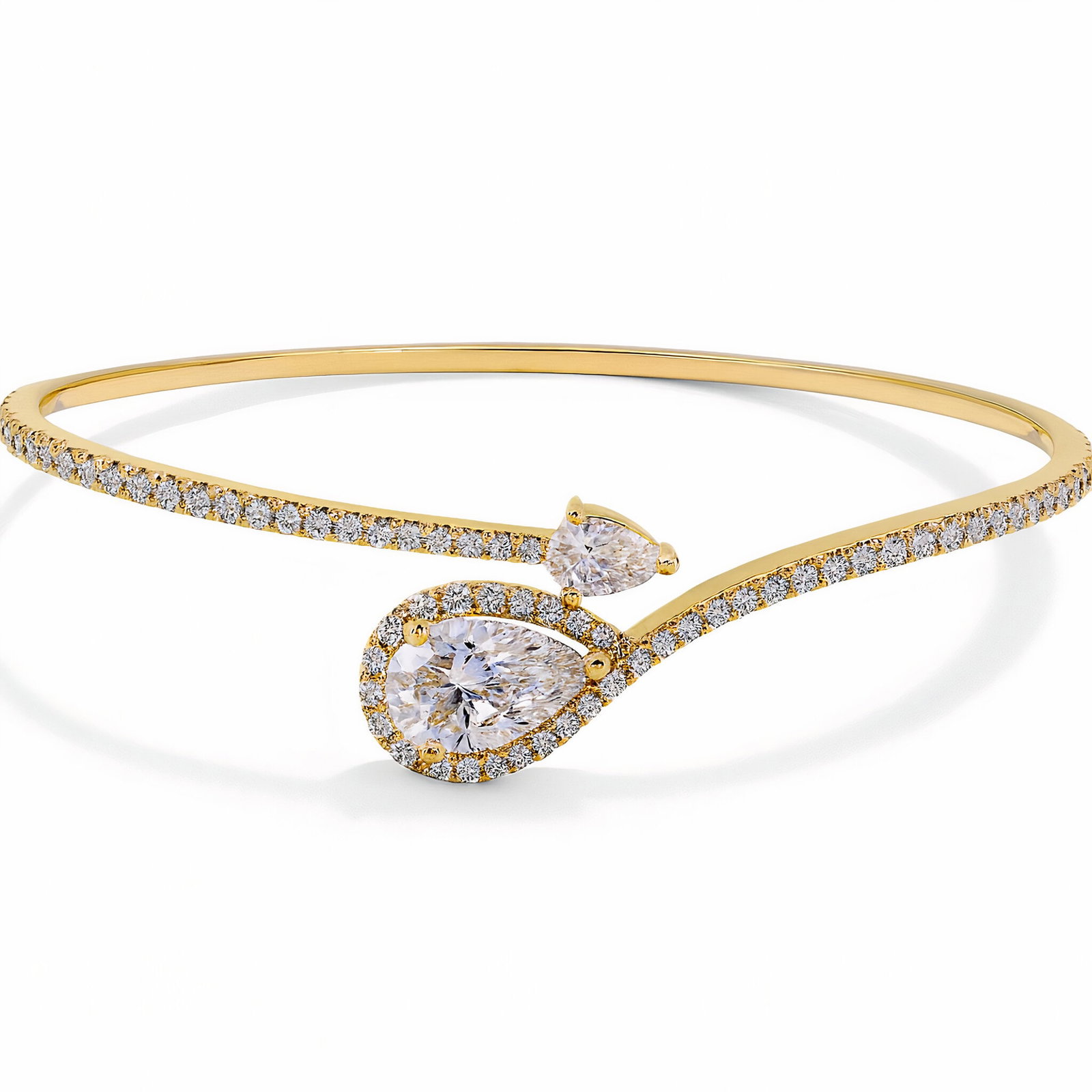 Lab Grown Pear Shape Bypass Diamond Bangle 2.32 Carats 14K Gold: Lab Grown diamond bypass bangle featuring one Pear shape weighing 1.07 carats and a smaller Pear shape, 0.16 carats, and 70 Round Brilliants weighing 1.09 carats in 14 karat yellow gold. Color D-E Cla