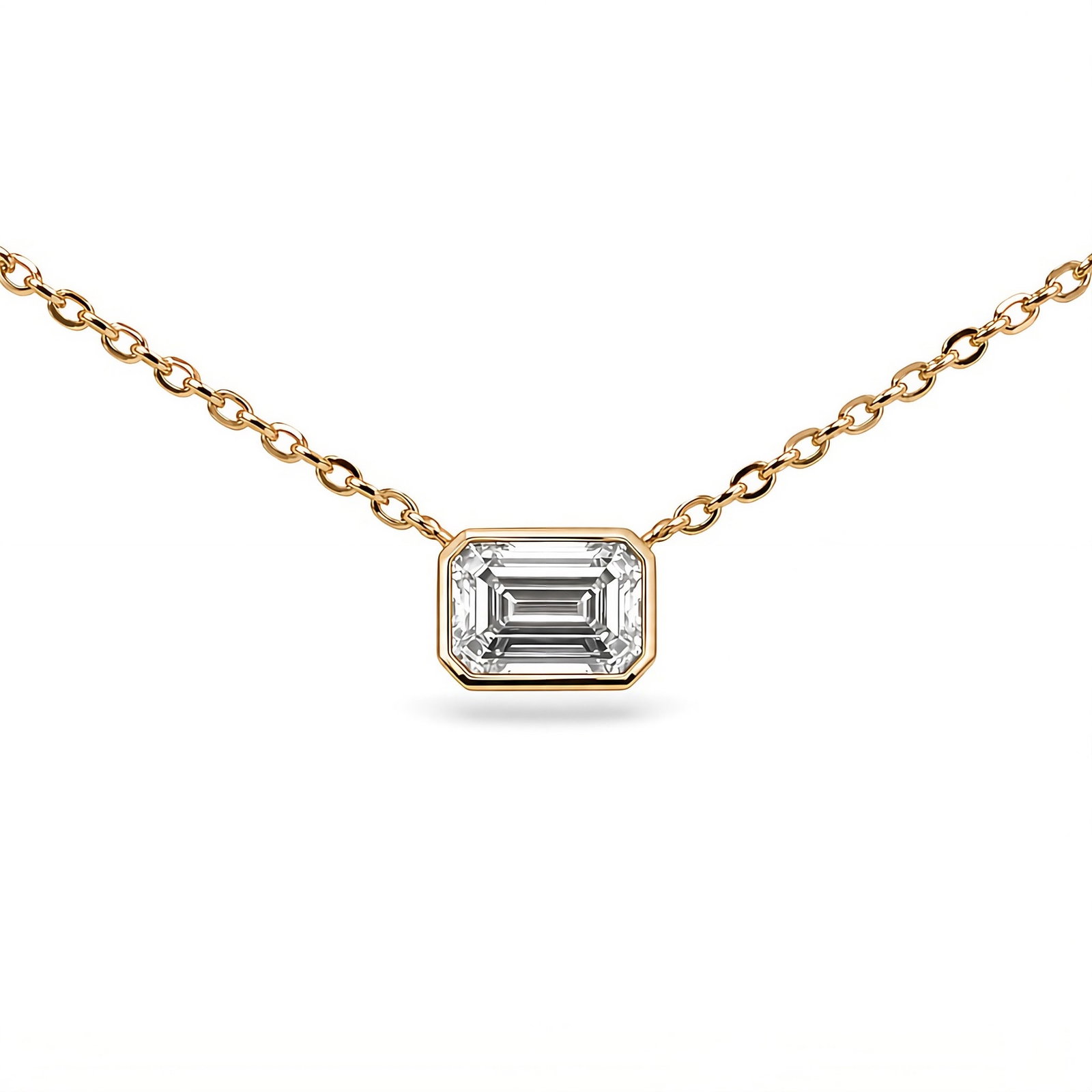 IGI Certified Lab Grown Emerald Cut Pendant 2.50 Carats 14K: IGI Certified Lab Grown Diamond featuring a 2.50 Carat Emerald Cut in a 14 Karat Yellow Gold bezel, extended on a cable chain. Color D Clarity VS1