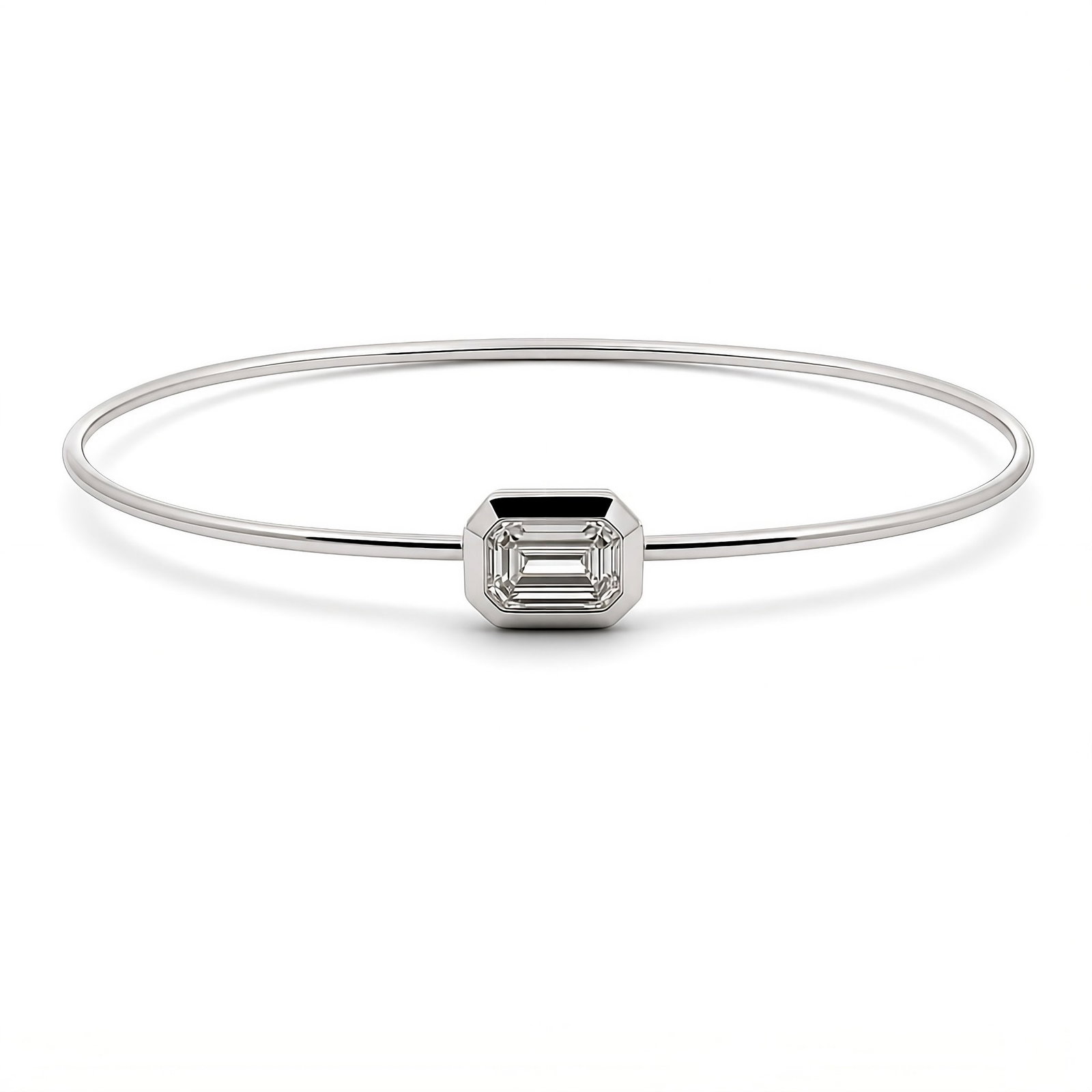 Lab Grown Emerald Cut Bezel Bangle Bracelet 0.64 Carats E-F VVS2-VS1 14K: Lab Grown diamond bezel bangle bracelet featuring an Emerald Cut Diamond weighing 0.64 Carats, in 14K White Gold. Color E-F ClarityVVS-VS1. Tube Bracelet - 1.3 MM
