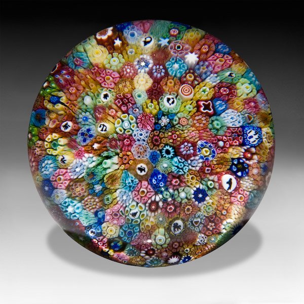 Baccarat 1971 close packed millefiori paperweight..: Baccarat 1971 close packed millefiori paperweight. Inspired by the antique Baccarat "church weight," the piece contains an assortment of colorful, intricate, complex canes, including the twelve differ