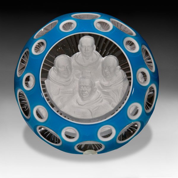D'Albret: D'Albret "Moon Astronauts" faceted blue overlay sulphide paperweight. The piece contains a white sulphide of four U. S. astronauts; Edwin Aldrin, Michael Collins, Neil Armstrong, and Alan Shepard, on