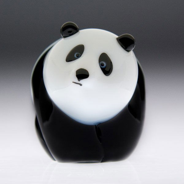 Orient and Flume: Orient & Flume Art Glass "Panda" glass sculpture. A three-dimensional panda, with a white face, black ears, and black circles around its eyes. Signed. Height 3 1/4".