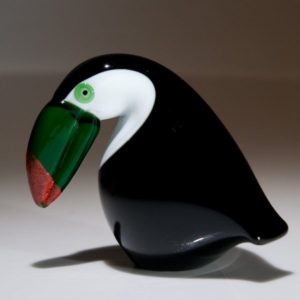 Orient and Flume: Orient & Flume Art Glass "Toucan" glass sculpture. The three-dimensional black and white toucan, has a large red-tipped green beak. Signed. Height 3 3/4".