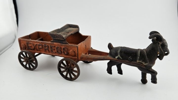Vintage Cast Iron Express Cart Pulled by a Goat.: Vintage Cast Iron Express Cart Pulled by a Goat. No Driver, so the Goat Must Have Directional Ability. It Has All Its Wheels.