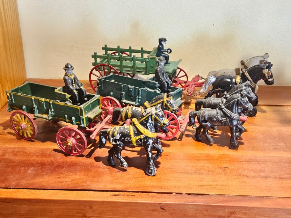 Three Horsedrawn Wagons in Heavier Cast-Iron Construction.: Three Horsedrawn Wagons in Heavier Cast-Iron Construction. The Two in the Front Are Older, the One in Back is Newer. They All Have a Driver and a Team of Horses. Manufactured by Stanley. The Newer One