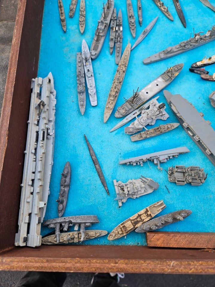 Display Case Full of Metal Ships: Display Case Full of Metal Ships. This includes primary military ships from 3 to 10" long. It is an impressive assortment. It is like a 140. It can ship with or without the showcase. The shipping esti