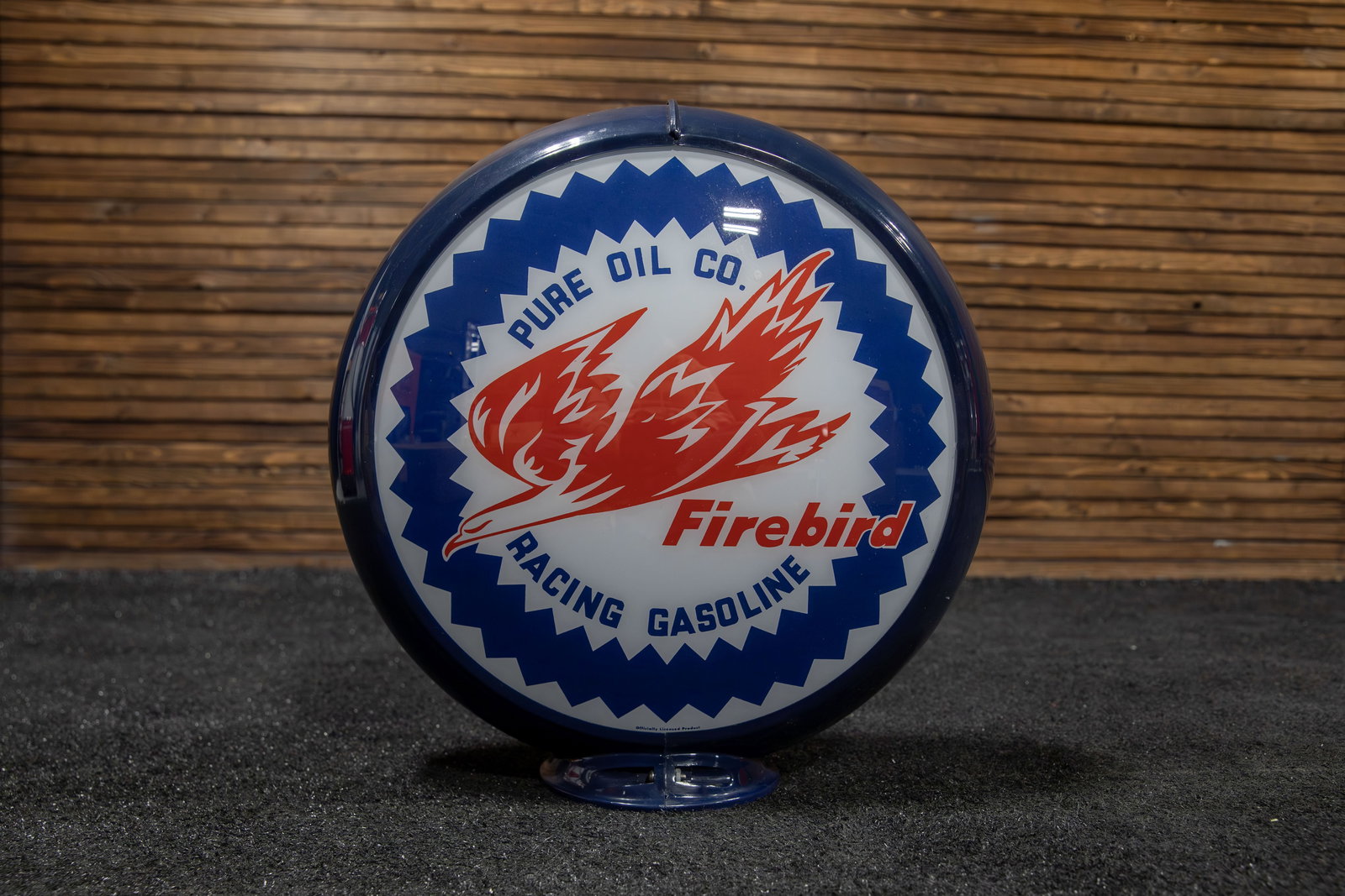 Firebird Gas by Pure Glass Pump Globe: Presents company brand name in dark blue with flaming Firebird in red, two-sided and mounted on dark blue plastic body, face is marked "Officially Licensed Product", age unknown.