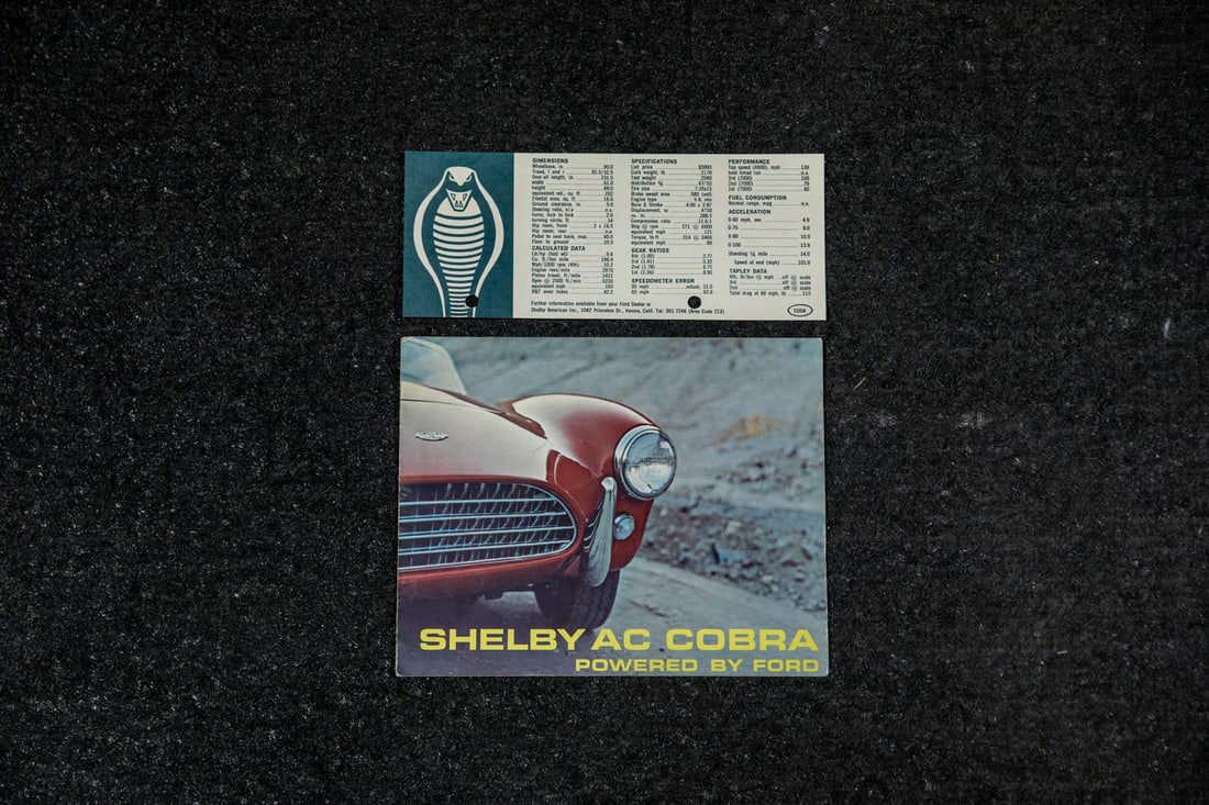 Original 1963 Shelby Cobra Sales Brochure and 1964 Price Card: Early piece of Cobra 260 advertising, color fold out sheet features images of car and specifications, also included is a 1964 Shelby Cobra price list as of June 1, 1964, green on white print, also