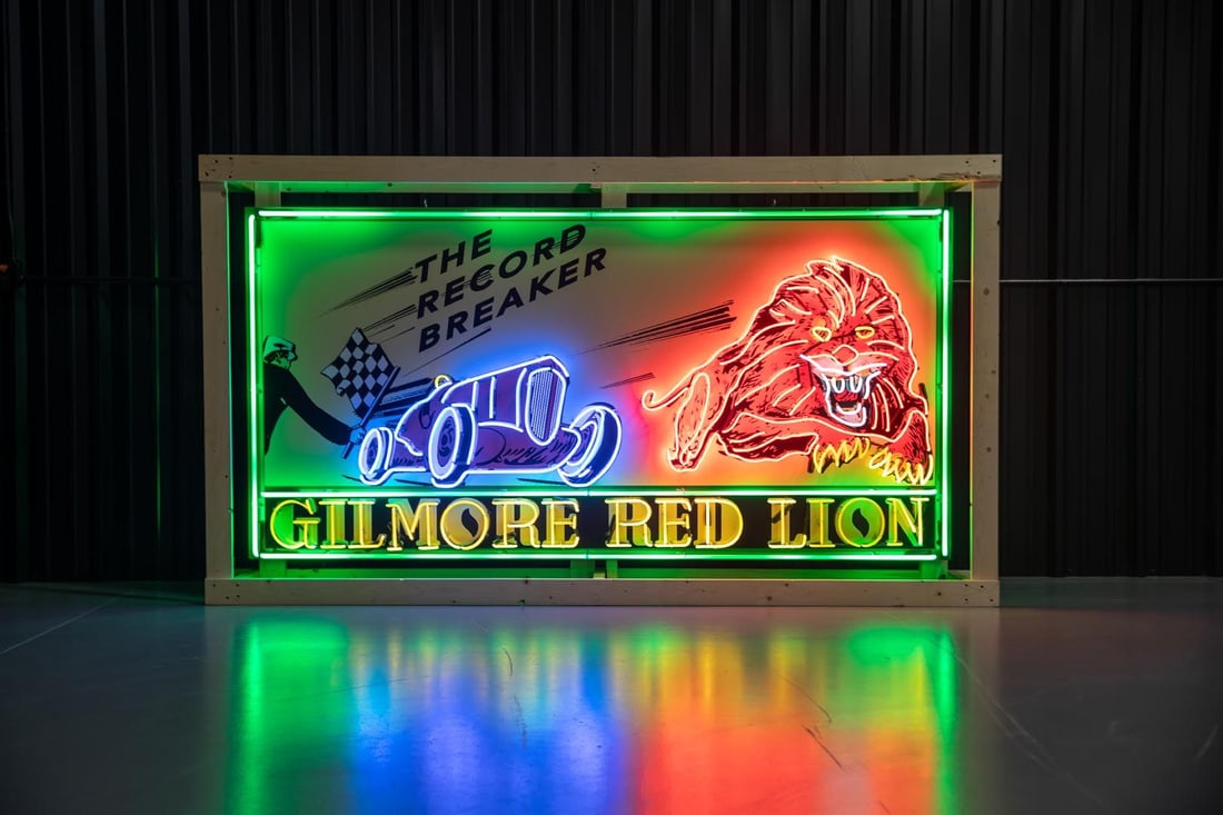 Custom Gilmore Red Lion-The Record Breaker Large Neon Sign: This is one of the most impressive pieces of artwork ever created in neon, using five colors it depicts a 1930s open-wheeled blue race car receiving the checkered flag led to victory by a charging Red