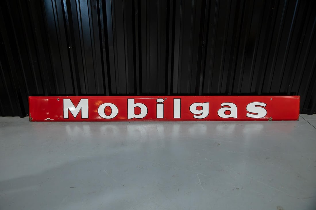 Mobilgas Self-Framed Single-Sided Porcelain Sign: SSP with excellent color and gloss, features white lettering on red field and beveled edges. Showing only minor wear around the mounting holes. Rated 8.75