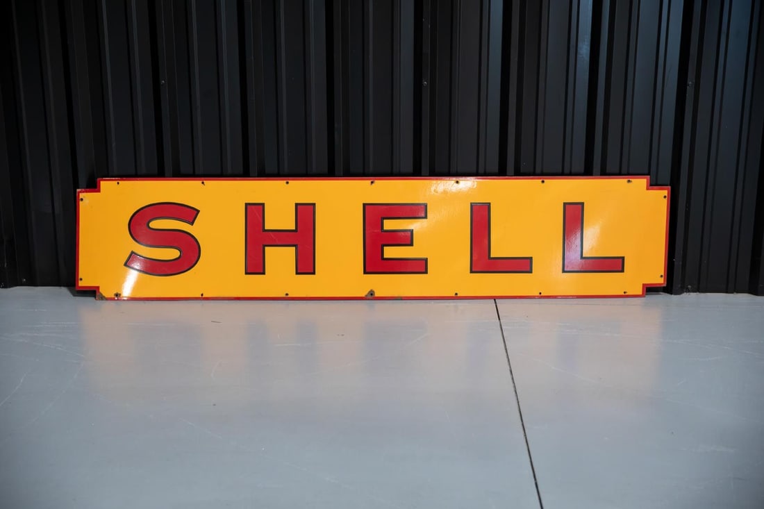 Shell Filling Station Single-Sided Porcelain Sign: SSP with excellent color and gloss, features bold red letters on amber yellow field. Shows only minor edge wear. Rated 9.0