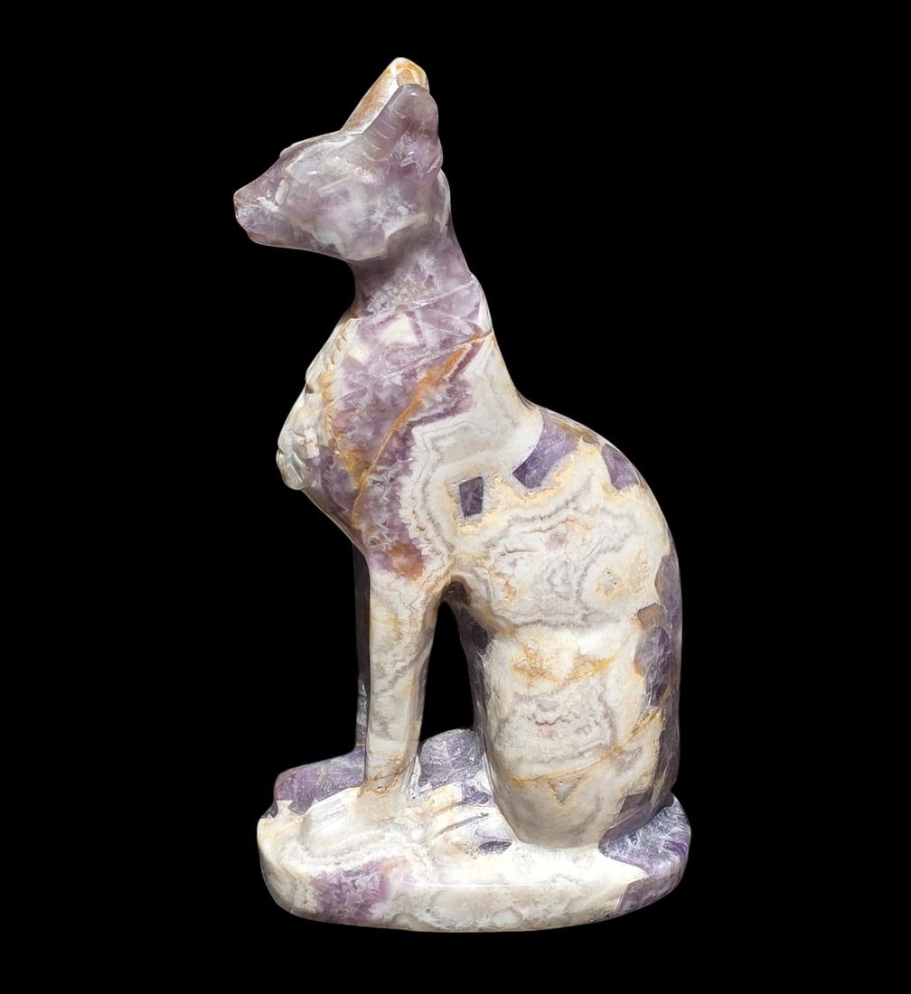 Carved Banded Mineral Amethyst Quartz Egyptian Cat Sculpture: Carved Banded Mineral Amethyst Quartz Egyptian Cat Sculpture. Measures 5 3/4" X 3" X 1 3/4" All items must be retrieved or shipped within 15 days of auction end. Items remaining in our possession afte