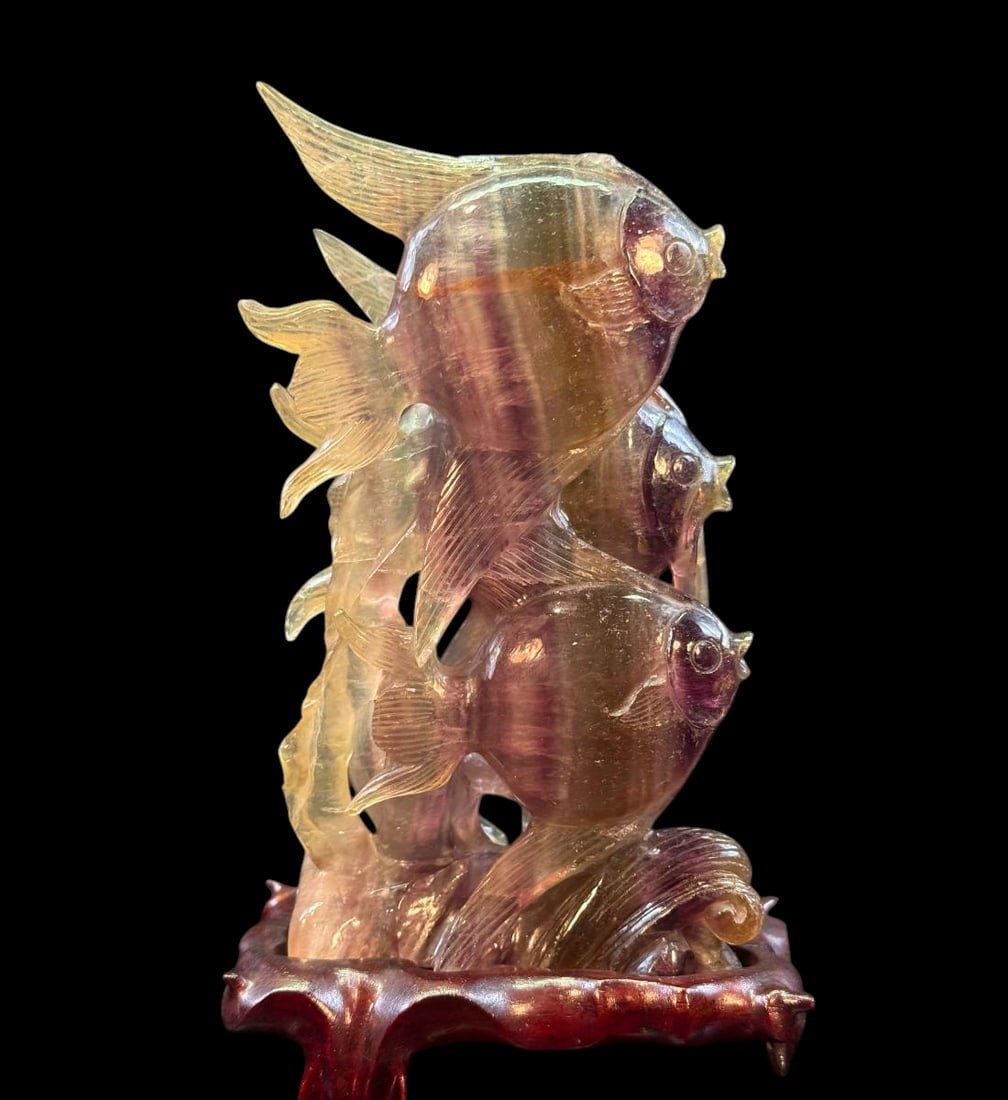 Antique amethyst crystal carving in the shape of three tropical fish ca 1900-20: Antique amethyst crystal carving in the shape of three tropical fish. Measures 8” tall and 5” wide overall. Circa 1900-1920. Provenance: Prolific collector DATO` Dr. Kenneth Chin Kin Lia, 