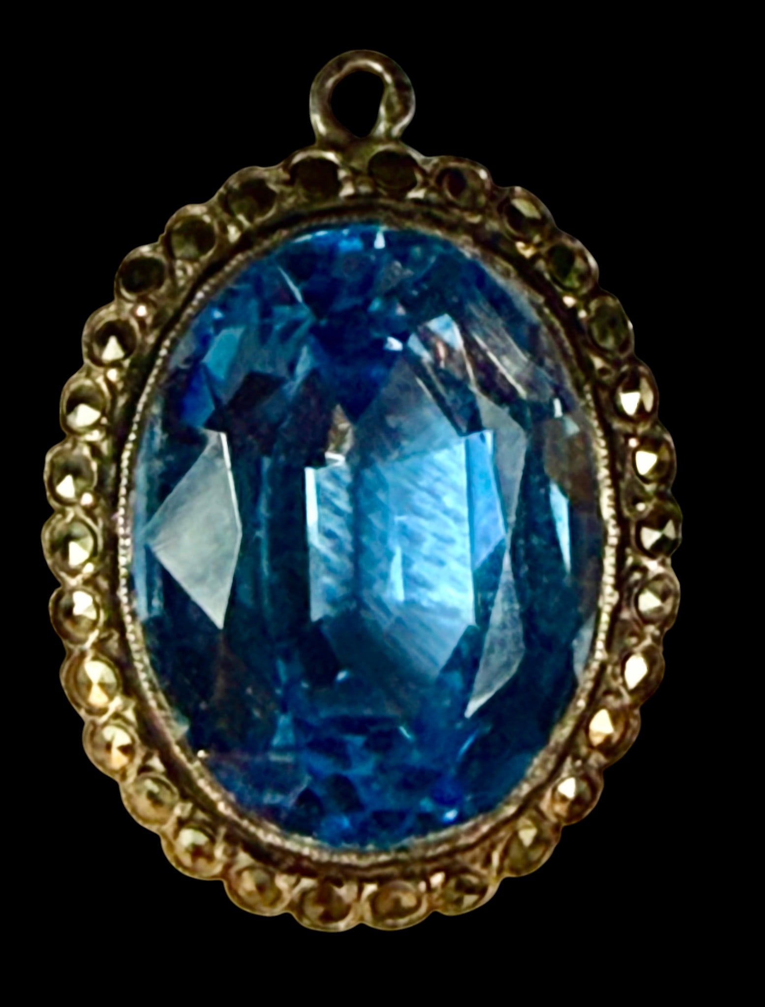 Antique Victorian pendant featuring blue cut aqua marine stone: Antique Victorian pendant featuring blue cut aqua marine stone set in a white metal unmarked basket pattern mount with cut pave stones surrounding. Measures 12.5 mm length. Excellent condition as foun