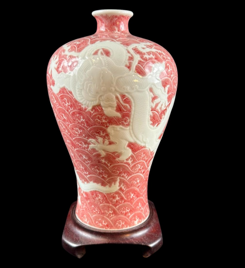 A fine & rare carved copper red decorated dragon meiping vase Yongzheng six character mark 1712-35: Magnificent antique Chinese porcelain meiping vase (plum blossom) featuring a carved white or reserved white dragon, soaring amidst underglaze copper red crashing waves, styled after rare Qing Dynasty