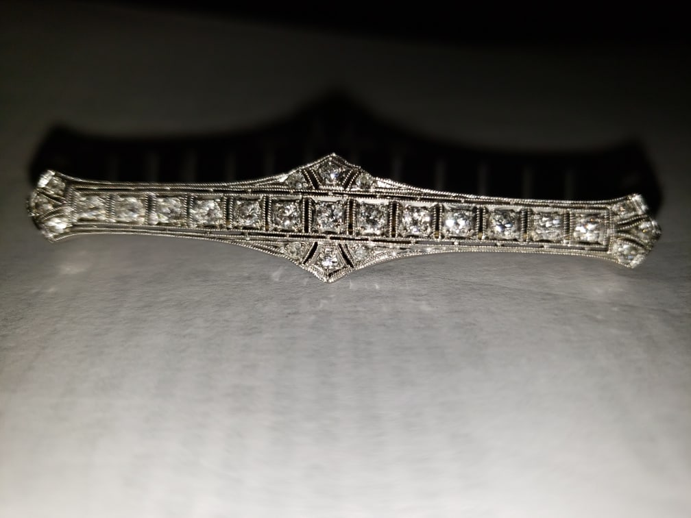 ANTIQUE ART DECO DIAMOND BAR PIN: ANTIQUE ART DECO DIAMOND BAR PIN CIRCA 1920. THESE PINS ARE CHARACTERIZED BY THEIR ELONGATED SHAPE, INTRICATE FILIGREE OPENWORK, AND THE USE OF “WHITE” METALS LIKE PLATINUM OR WHITE GOLD. 