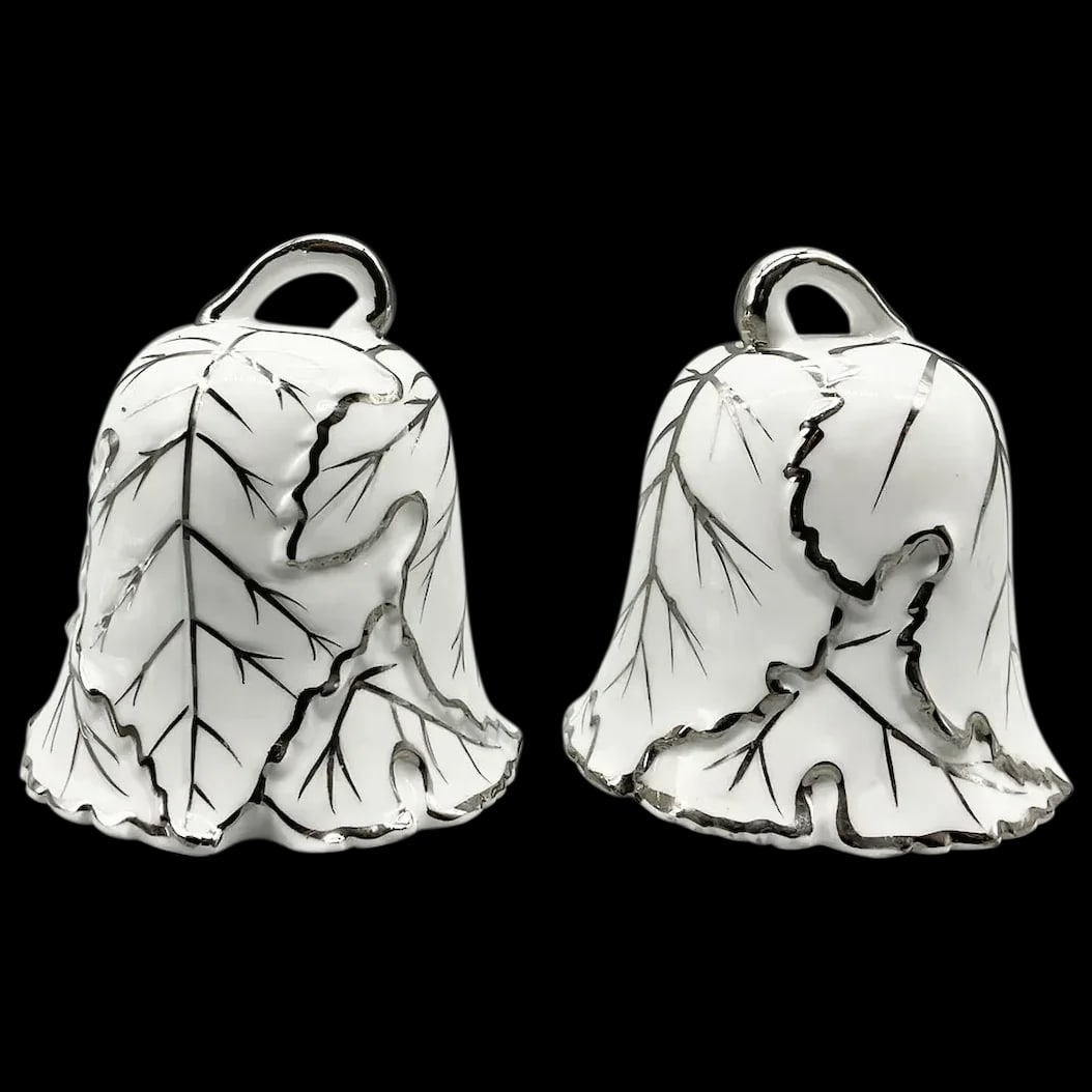 Pair of Silver and White Bells: Porcelain and numbered G804 in a leaf pattern. Excellent handcrafted quality in excellent vintage condition. May also be used a Christmas Tree Ornament