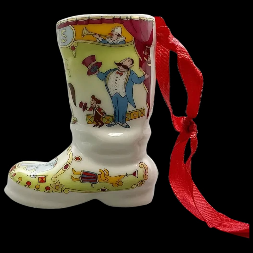 Christmas Ornament: Hutshenreuther Santa’s Boot Ornament 2002 Signed portraying circus scenes, the ring master, acrobats, elephant, annoying bear, clown and more. Mint condition, 2002 edition, marked in gold, mint 
