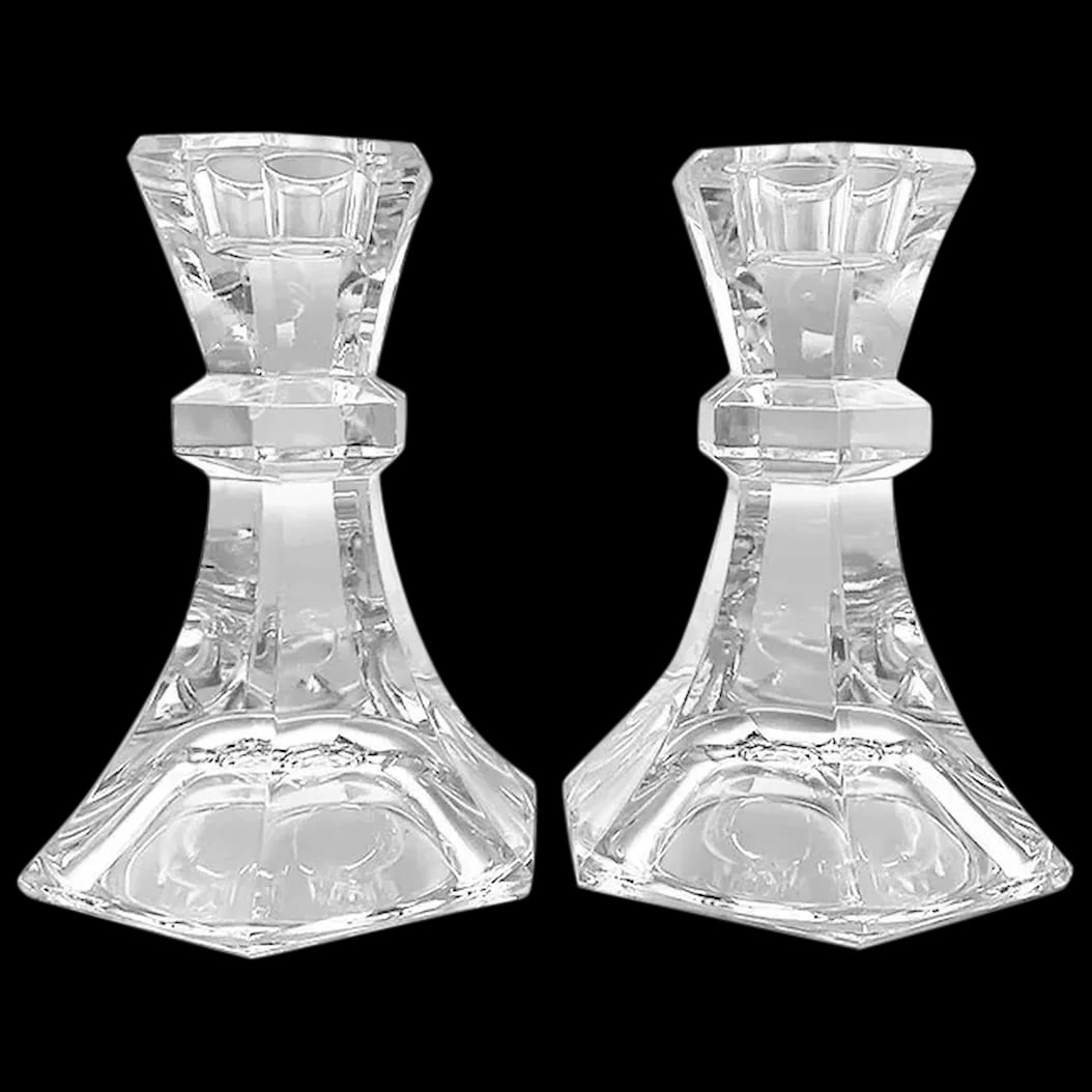 Candle Sticks: This pair of Crystal Candle Sticks do not have an obvious mark,. They are heavy and feature a three dimensional intricate design that catches light from every angle giving off a rainbow prism when