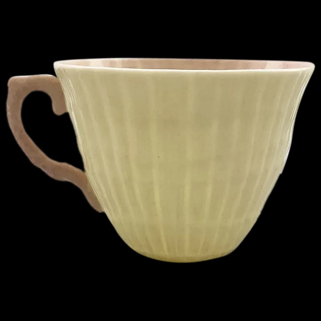 Tea Cup: Belleek Pink Neptune Seashell Tea Cup signed and numbered #0857. Rare and collectible. It is in mint condition.