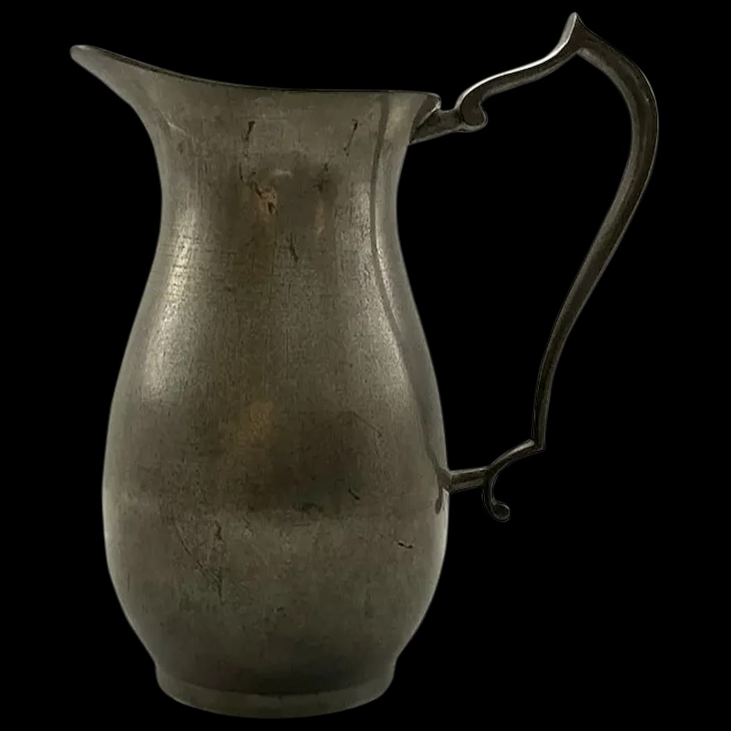 Pitcher: Pewter Pitcher from Woodbury Pewters Co. started in 1950 in Woodbury, Connecticut and still manufacturing traditional and contemporary pieces. They are Marked with an Eagle Woodbury Pewters, No Lead: 