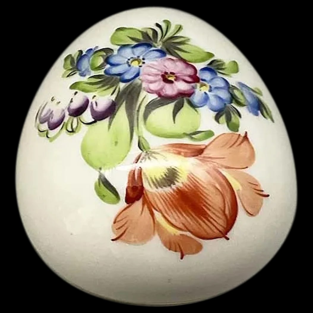 Egg Shaped Trinket Box: This beautiful porcelain egg was made by Herend, a company still renowned for its exquisite porcelain, quality and design. The pattern is Printemps which means spring. The pretty bouquet made up of