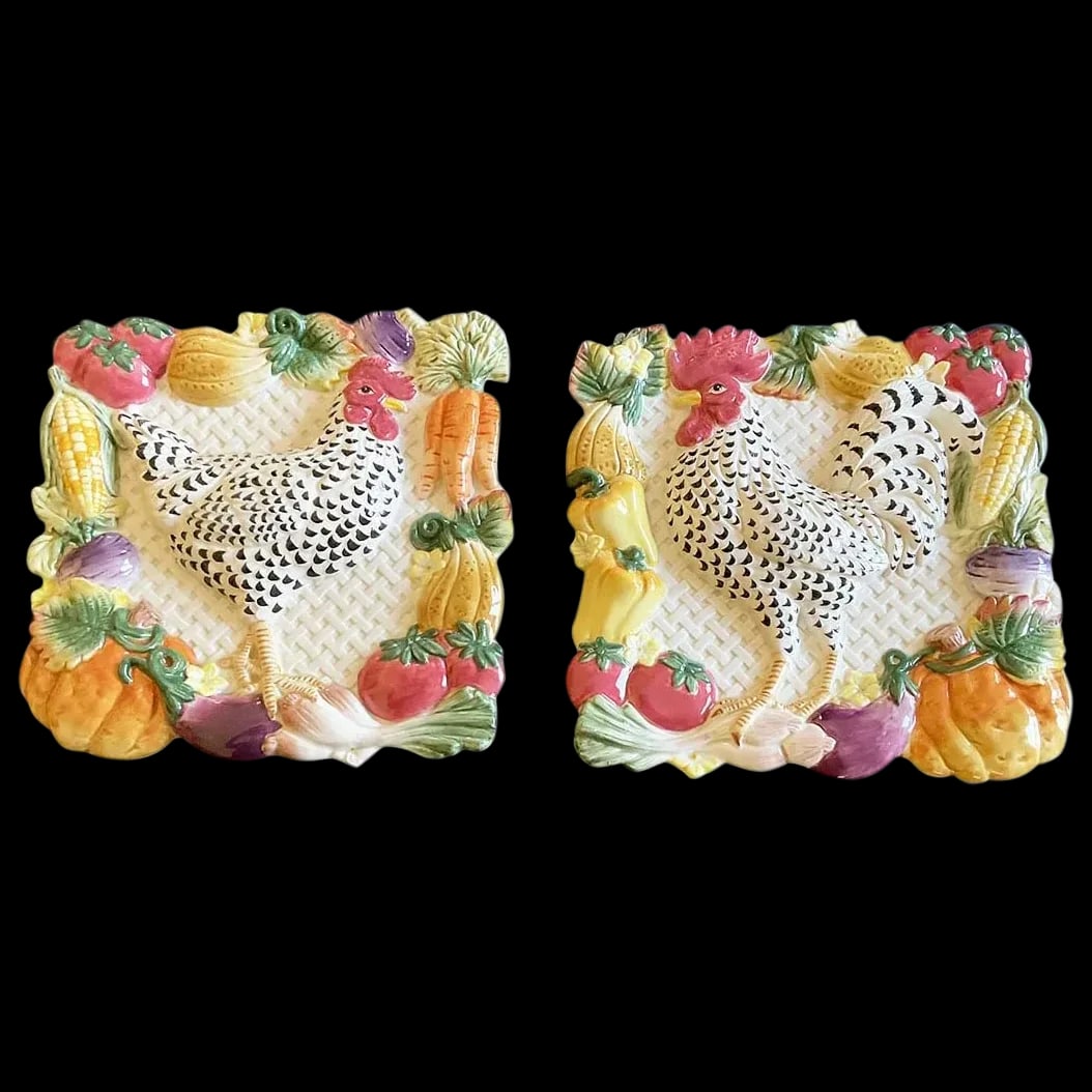 Pair of Wall Plaques: Fitz and Floyd Gardening Gourmet Rooster and Hen Wall Plaques with the speckled black and white rooster and hen are surrounded by vibrant colored colored vegetables fresh picked right our of the