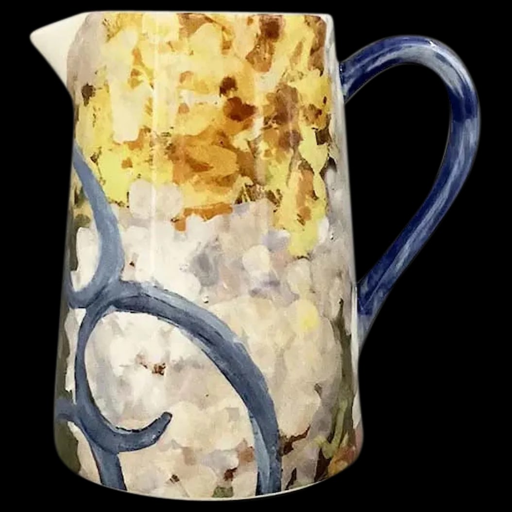 Creamer: Gien Chaise Bleue Creamer is hand painted and handmade in France. It makes a beautiful piece of art on your table. The design is a pretty blue garden chair in an impressionist flower garden. New used
