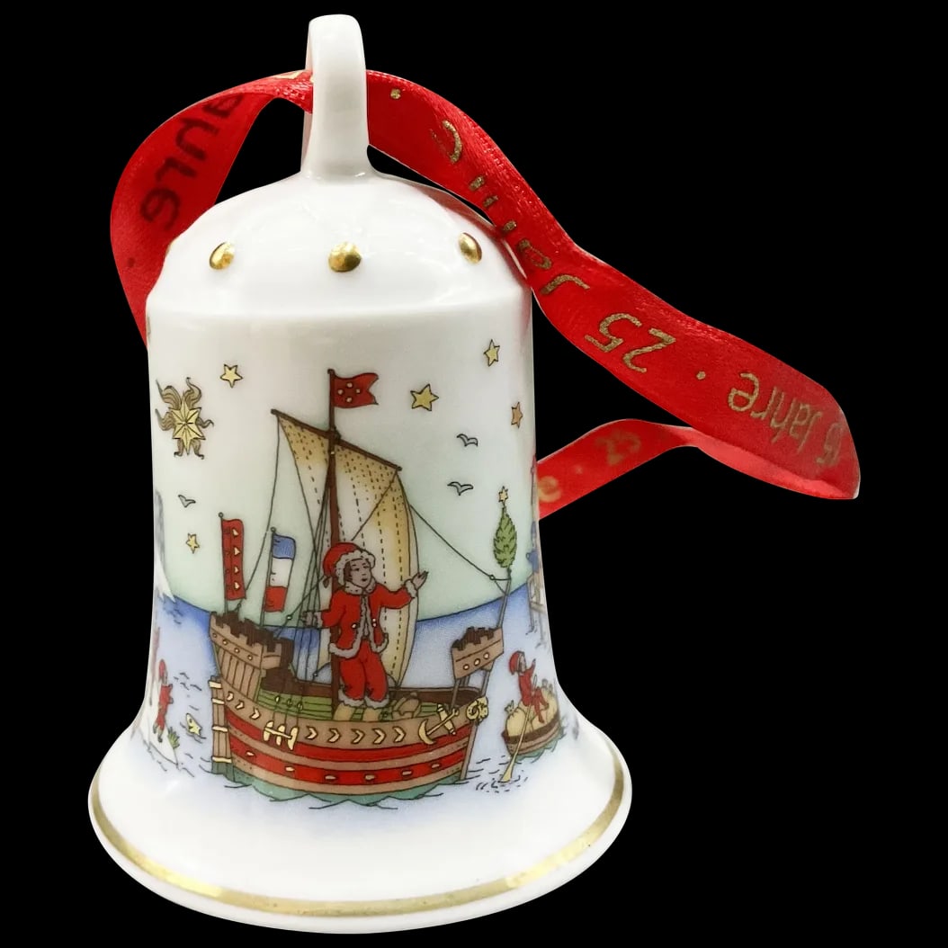 Christmas Bell Ornament: Hutschenreuther Christmas Sea Town Ornament year 2002. Depicts a quaint little seaport town with its inhabitants going about their daily routine, fishing, playing and working. Mint in original box.