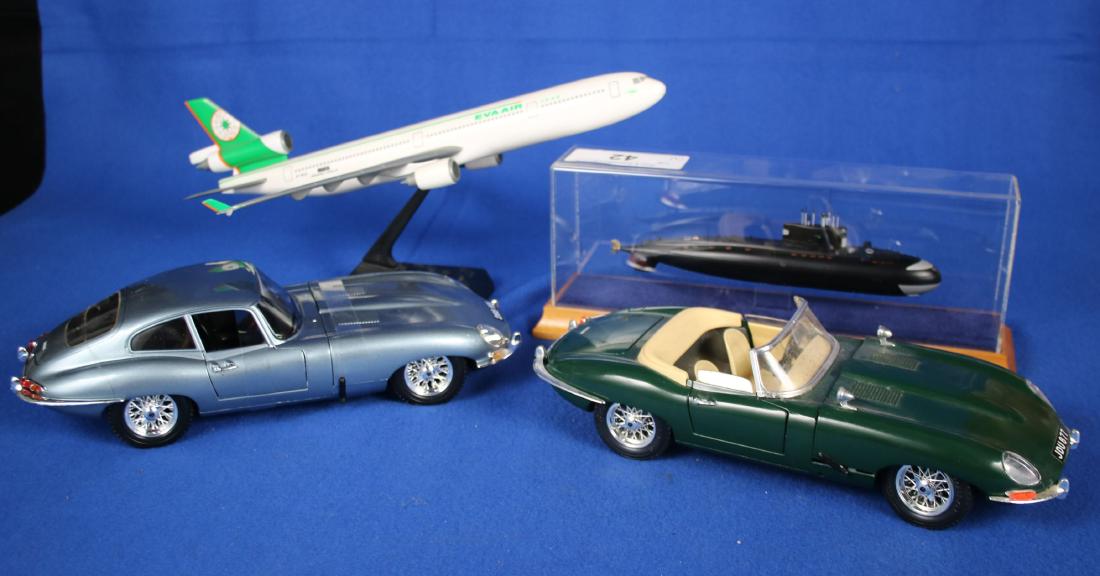 4 Model Toys: 2 Jaguar E Burago E Model Cars; Eva Air Model Plane, approx 12.5" long; Russian Submarine Model in case;