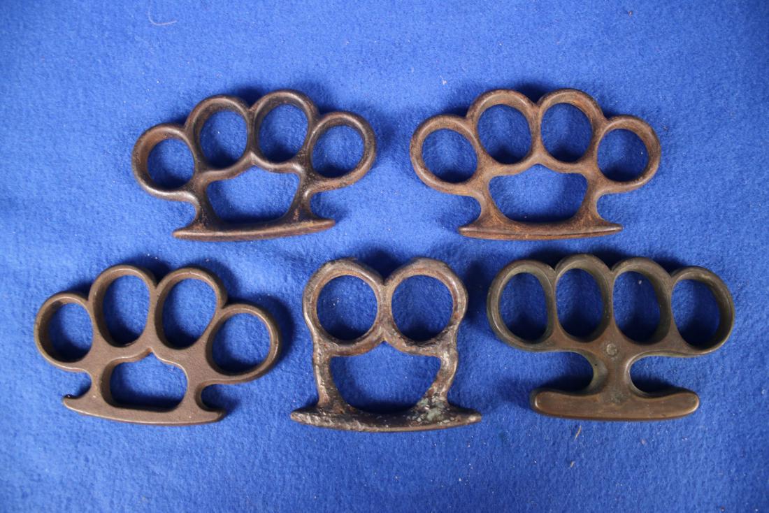 5 Sets of Knuckle Dusters: One is a two knuckle; Three are iron
