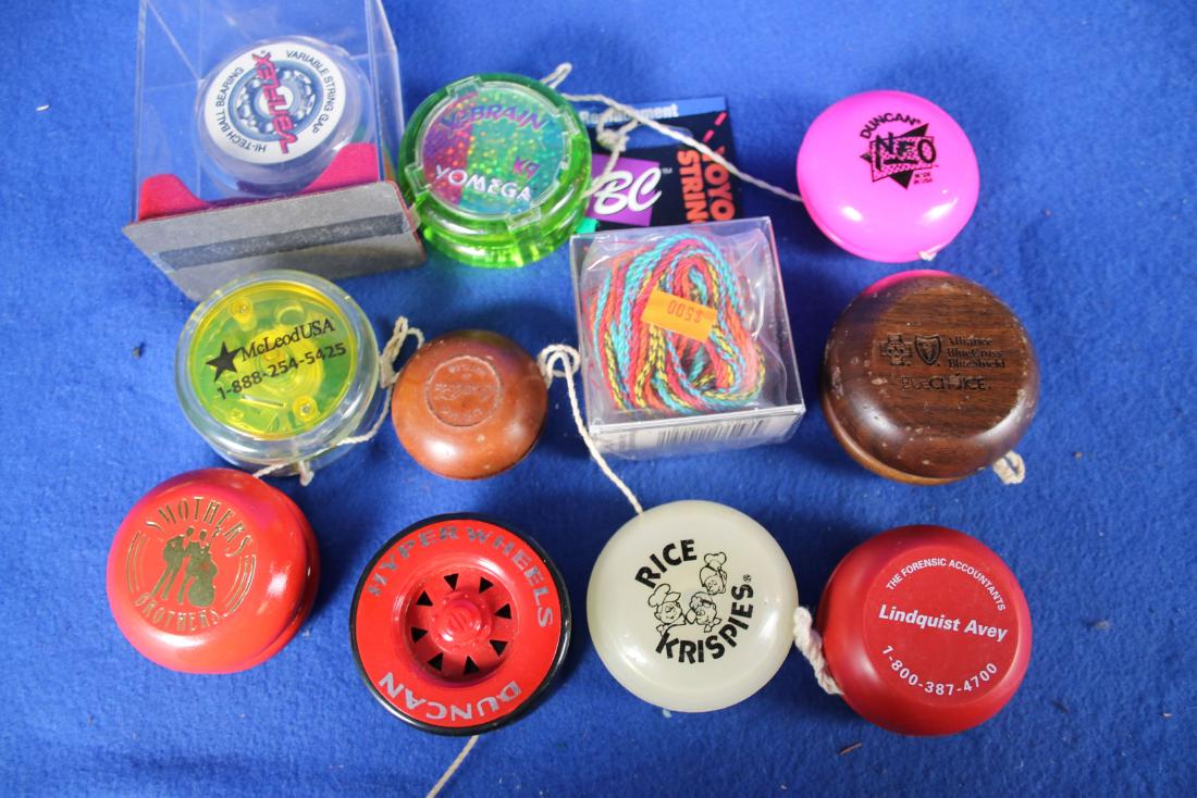 10 Yo-Yo's: One is Coca-Cola; One is Rice Krispie; One is Duncan Hyper Wheel; One is Kodak Smothers Bros.; and more