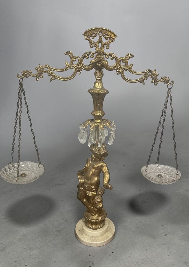 Hollywood Regency Scales of Justice: Hollywood Regency scales of justice are unlike functional scales and were designed during the mid-20th century (primarily the 1960s and 70s) to serve as dramatic accents to a room or office. This
