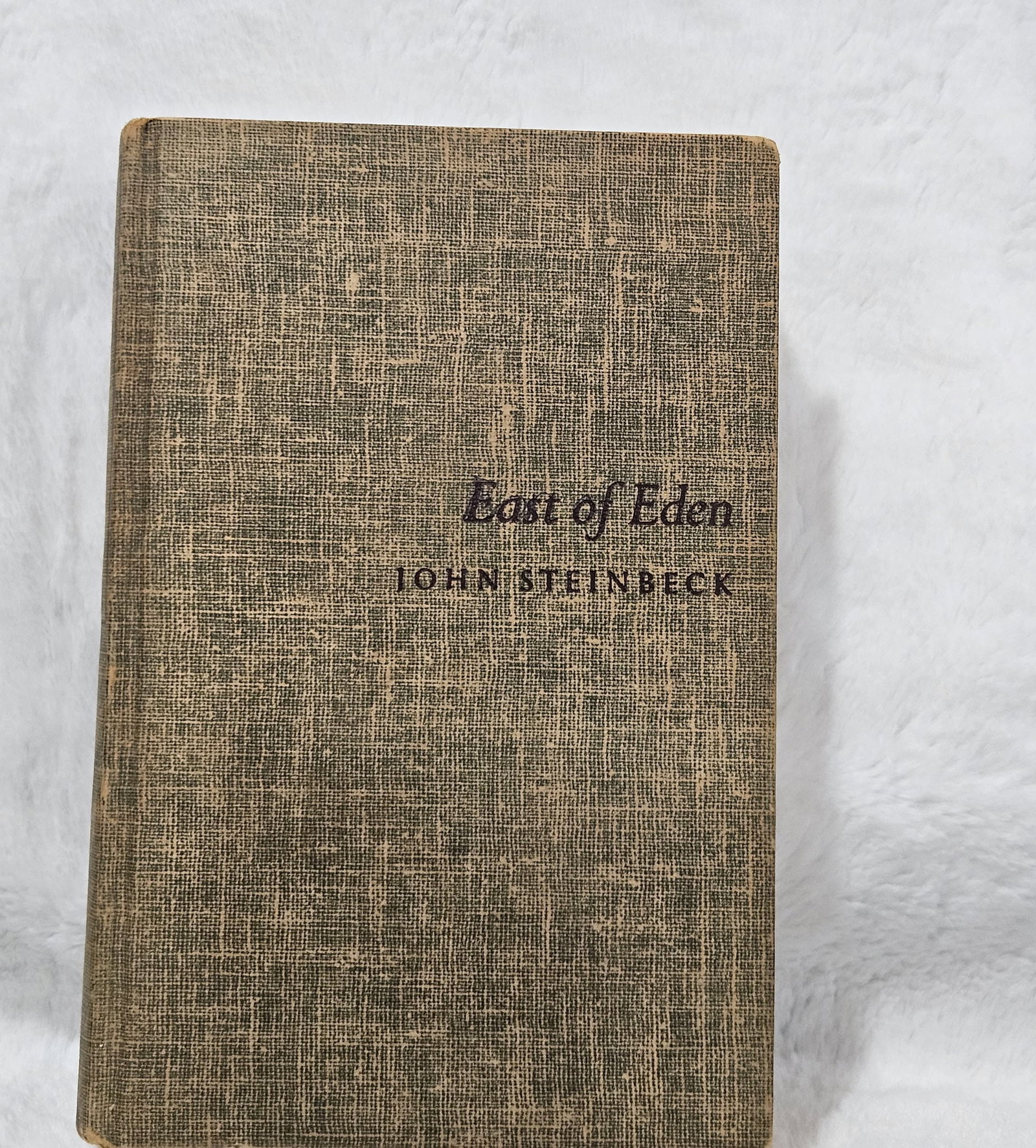 East of Eden - John Steinbeck: This is a vintage first edition hardcover. Copyright 1952. Both Cover and pages show signs of aging with discoloration. Some inside spine an page damage. See Photos.