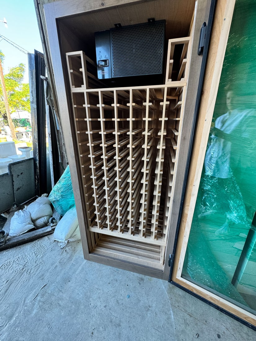 Full Size 99 Bottle Wine Refrigerator: Full size 99 bottle wine refrigerator., with room for 2 cases at bottom. Measurements: 35" x 79" x 30" (32"d with door handle)
